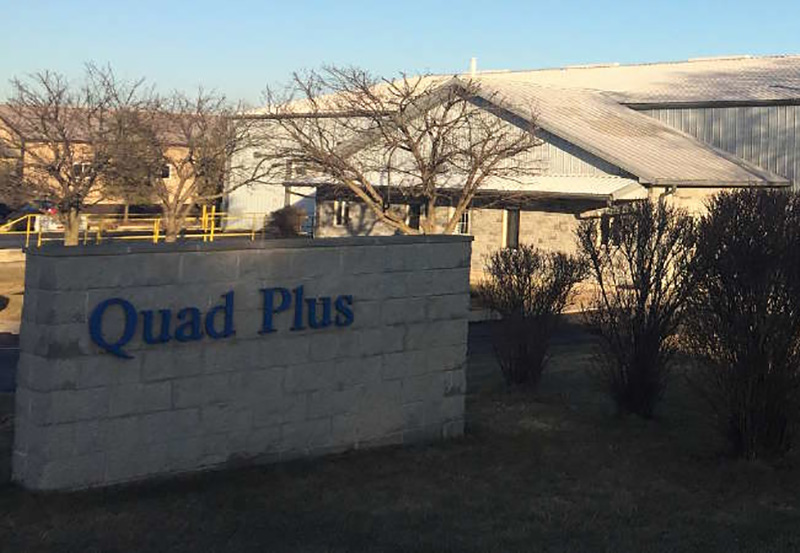 our story header image of quad plus hq